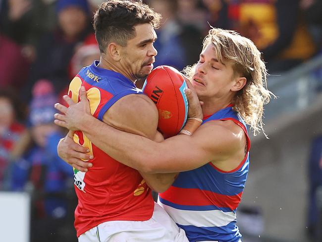 AFL Round 4.   10/04/2021.  Western Bulldogs vs Brisbane Lions at Mars Stadium, Ballarat.   Charlie Cameron of the Lions tackled by Bulldog Bailey Smith during the 3rd qtr.   . Pic: Michael Klein