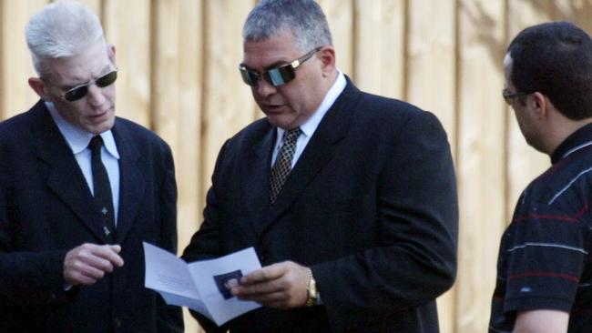 Mick Gatto, centre, attends the funeral of Graham Kinniburgh after his murder in 2003. Picture: Peter Ward