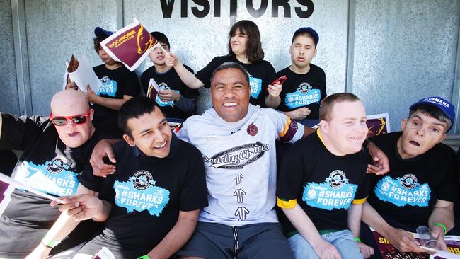 Petero Civoniceva poses with members of Kuraby Hub at Multicap’s Inter-Service Rugby League Cup at Dolphin's Leagues Club in Redcliffe. Picture: AAP Image/Claudia Baxter