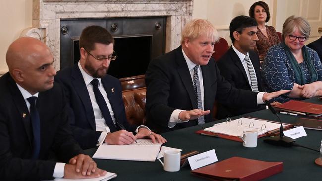 Boris Johnson chairs cabinet on Tuesday hours before the resignations of Sajid Javid, left, and Rishi Sunak, right. Picture: AFP