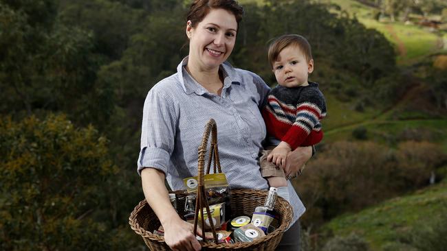 Kelly Magor, holding son Lincoln, has the go-ahead to begin a $5 million development for a commercial gourmet food kitchen at Brownhill Creek. Picture: Simon Cross