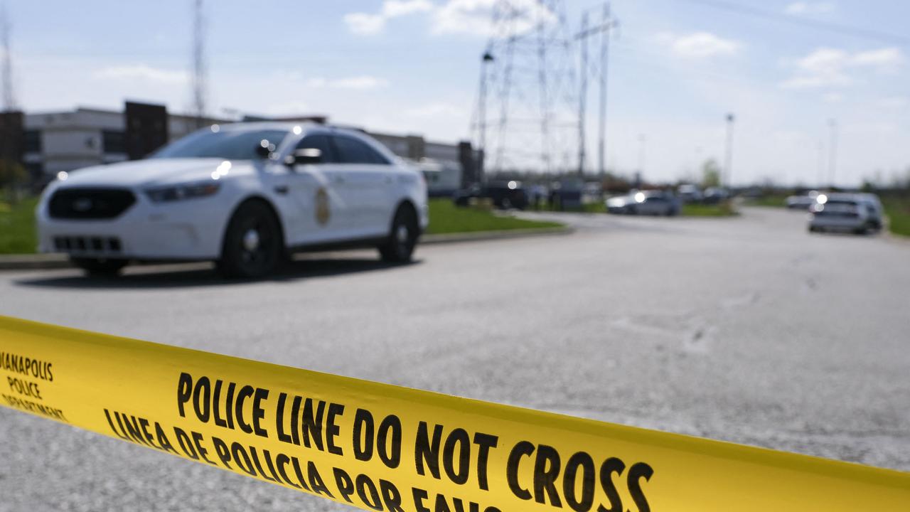 Police at the site of the mass shooting at FedEx, Indianapolis where a teenage ex-staffer gunned down eight people. Picture: Jeff Dean/ AFP