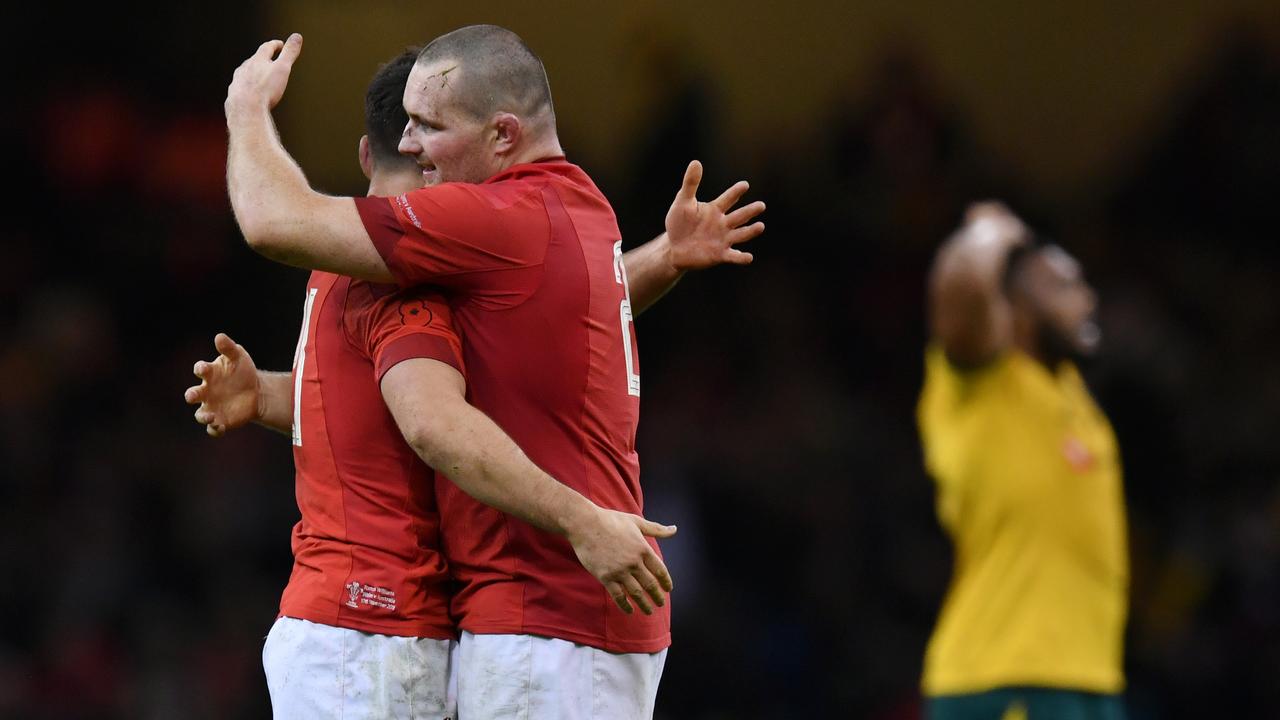 Tomos Williams and Dan Biggar of Wales celebrate on the final whistle.