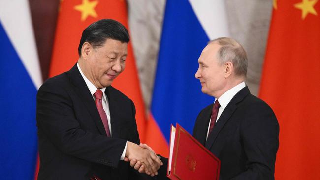 Russian President Vladimir Putin and China's President Xi Jinping shake hands during a signing ceremony following their talks at the Kremlin in March. Picture: AFP