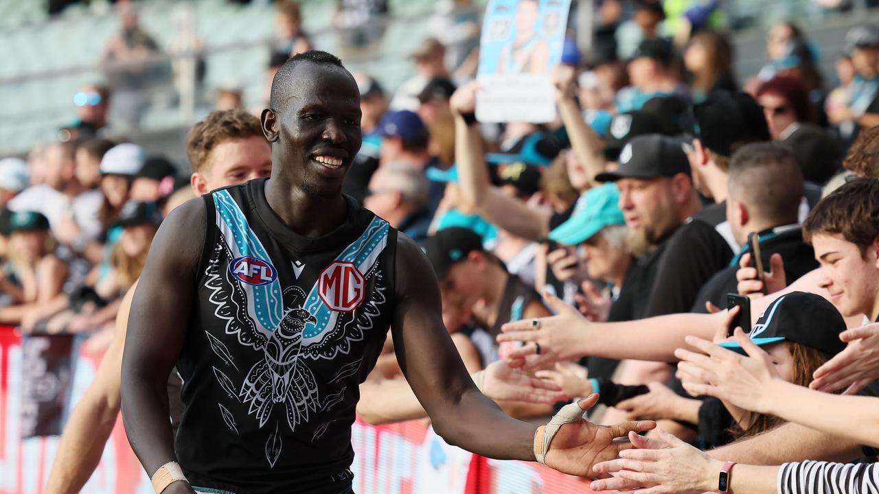 Aliir Aliir celebrates with Power fans. Picture: James Elsby/AFL Photos via Getty Images