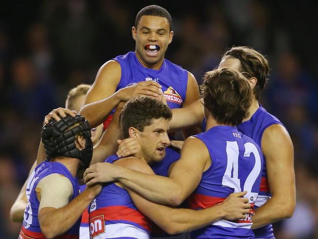 The Dogs celebrate an early goal.