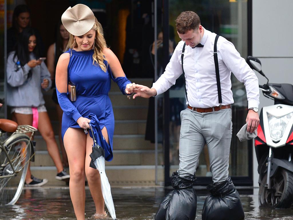 Flash flooding in City Rd Southbank on Melbourne Cup Day. Racegoers trying to make their way to the races. Picture: Nicki Connolly