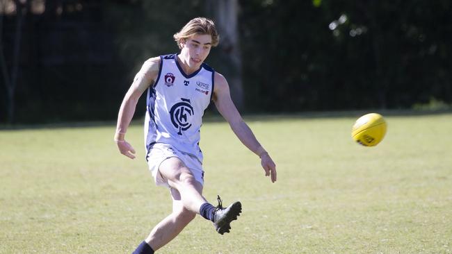 Coorparoo’s Patrick Cockrill kicks in the colts.Image Sarah Marshall)