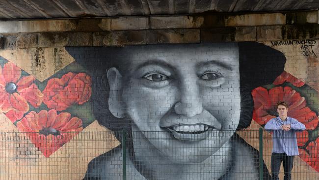 Artist Zac Bunston by his mural under the railbridge in Wantirna Rd, Ringwood. Picture: Lawrence Pinder.