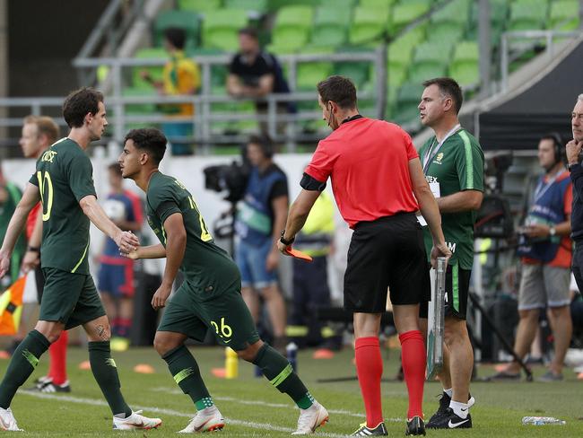 Socceroos coach Bert van Marwijk watches as Daniel Arzani is subbed on