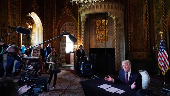 Then president Donald Trump speaks to the press after talking to members of the military via teleconference from his Mar-a-Lago resort in Palm Beach, Florida, on Thanksgiving Day.