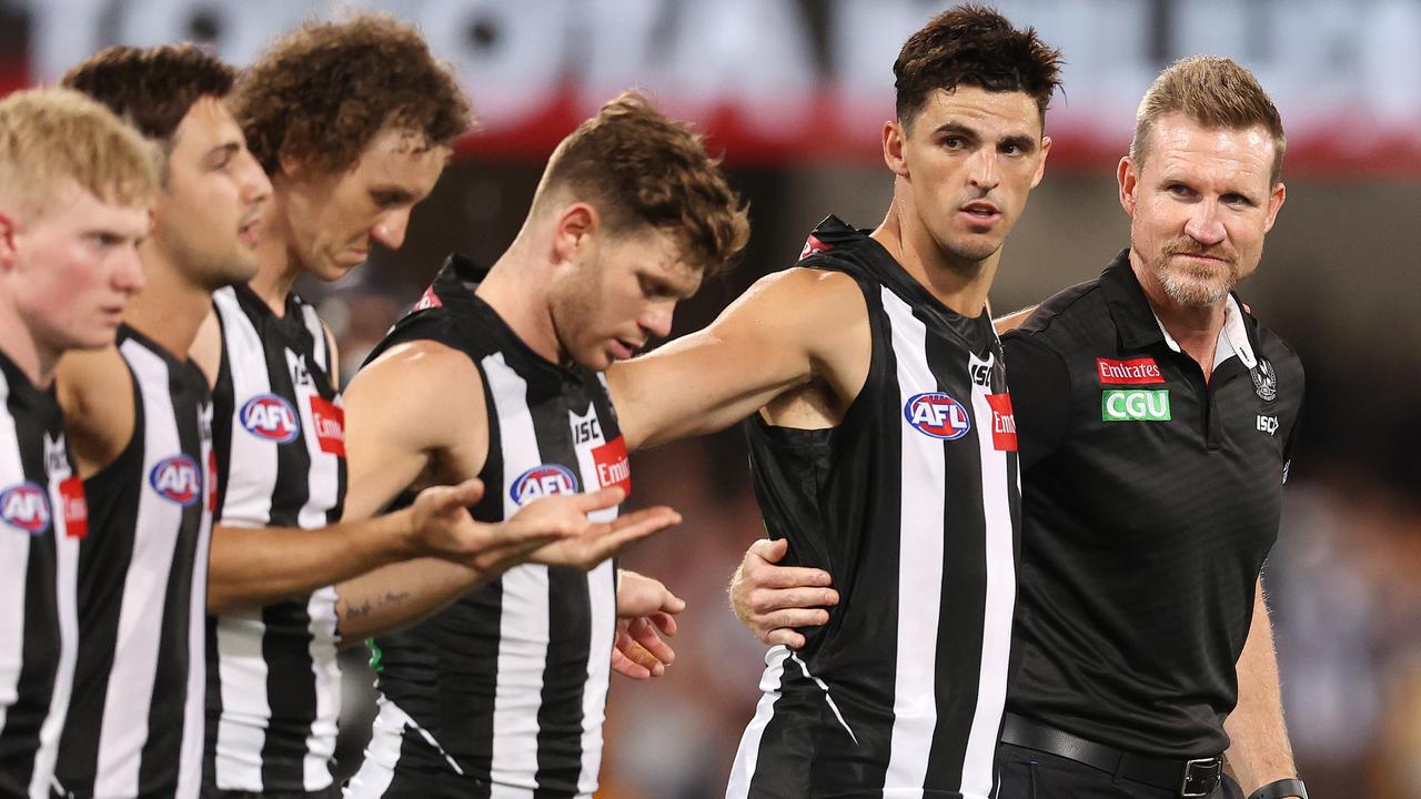 Nathan Buckley (right) and Scott Pendlebury line up for the national anthem pre game. Picture: Michael Klein