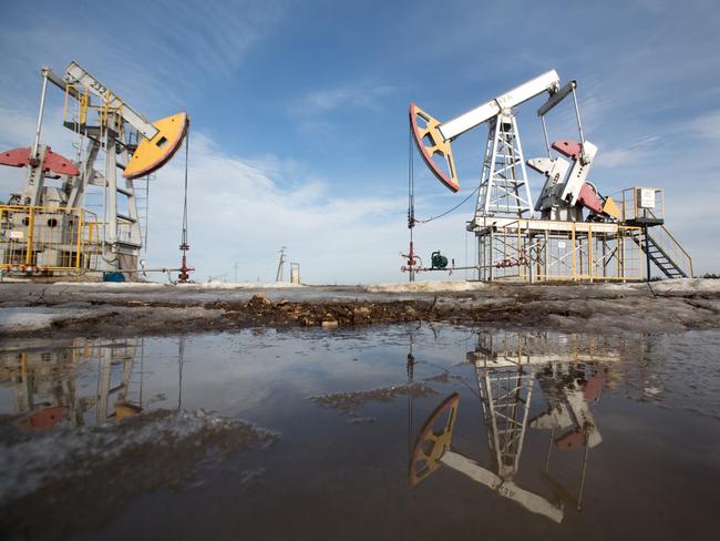 Oil pumping jacks, also known as "nodding donkeys", stand in an oilfield near Almetyevsk, Tatarstan, Russia, on Wednesday, March 11, 2020. Saudi Aramco plans to boost its oil-output capacity for the first time in a decade as the worlds biggest exporter raises the stakes in a price and supply war with Russia and U.S. shale producers. Photographer: Andrey Rudakov/Bloomberg via Getty Images