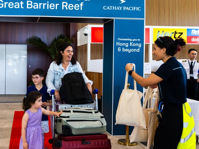 The Mizzi family - Max, 6, Ellie, 4, and Jessica Mizzi were among the first passengers on Cathay Pacific's return to Cairns.