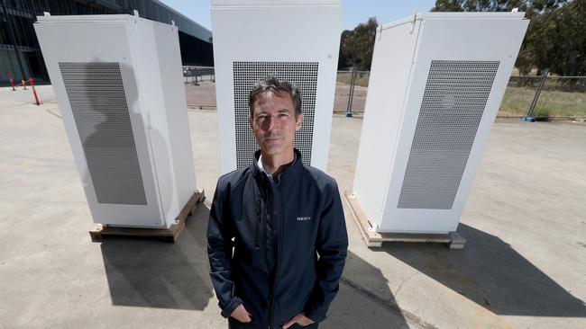 Neoen Australia managing director Louis de Sambucy with Tesla batteries. Picture: AAP / Kelly Barnes