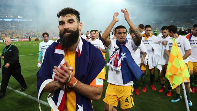 Mile Jedinak and Tim Cahill celebrate the win over Honduras last night. Picture: Phil Hillyard