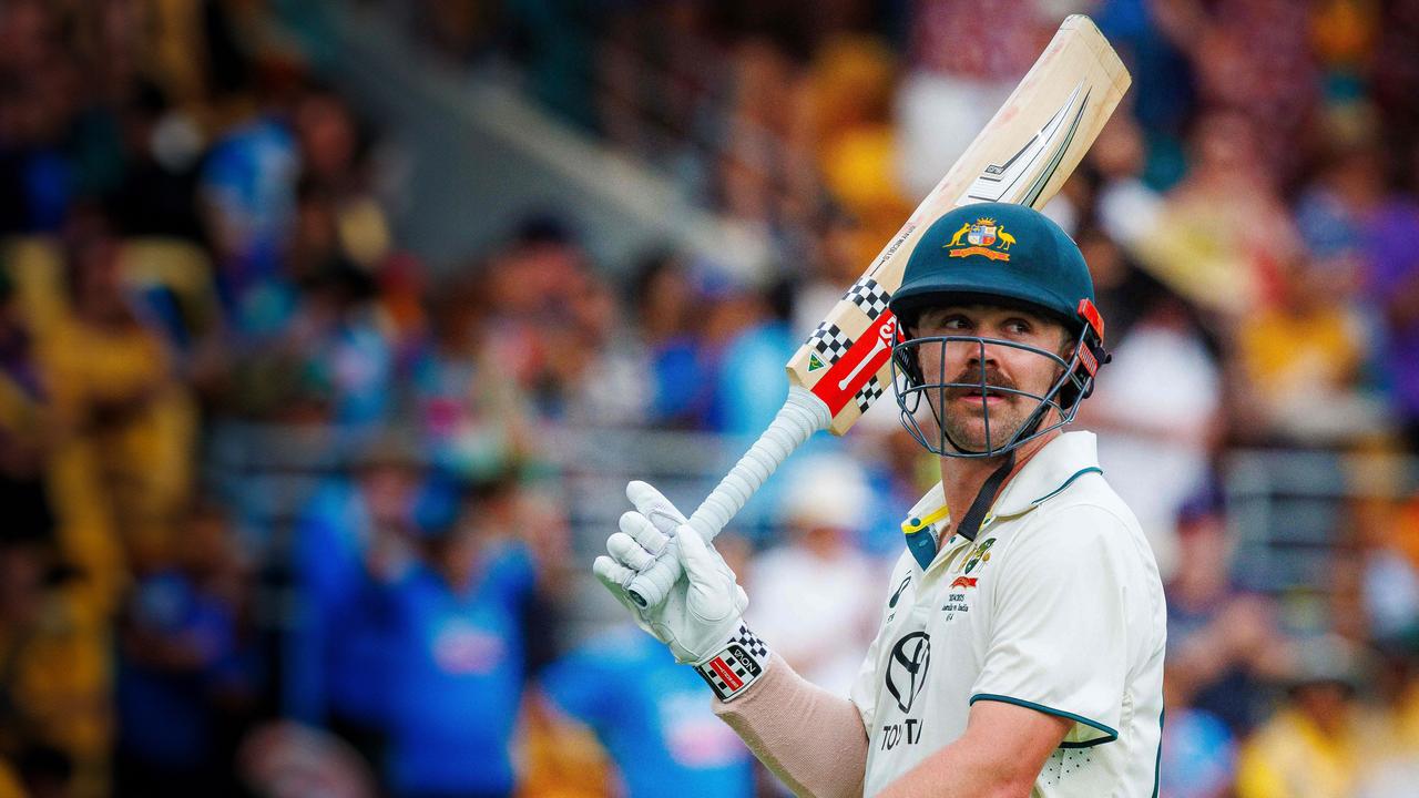 Australia's Travis Head acknowledges the crowd as he departs after a century against India. (Photo by Patrick HAMILTON / AFP)