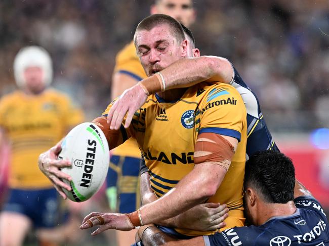 TOWNSVILLE, AUSTRALIA - SEPTEMBER 23: Shaun Lane of the Eels is tackled during the NRL Preliminary Final match between the North Queensland Cowboys and the Parramatta Eels at Queensland Country Bank Stadium on September 23, 2022 in Townsville, Australia. (Photo by Bradley Kanaris/Getty Images)