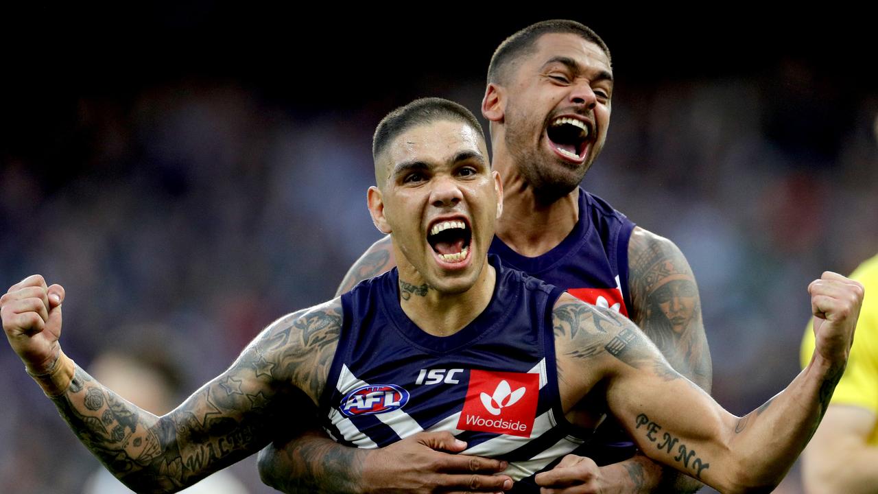 Bradley Hill celebrates with relative Michael Walters during his time at the Dockers.