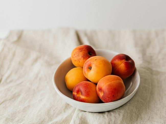 EMBARGO FOR TWAM, 16 NOVEMBER 2024. FEE MAY APPLY.   Fresh apricots in bowl on table. Photo: Karolina Grabowska / Pexels