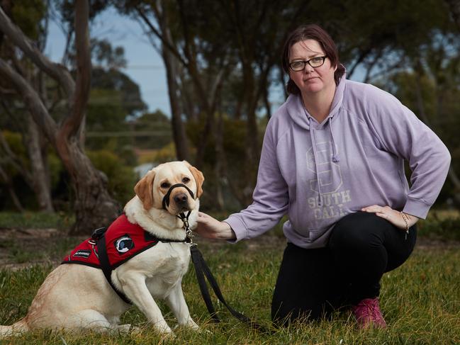 Murrianna Reese poses for a picture with her fully qualified assistance dog, Hunter, 3 outside her home in Murray Bridge , after they were refused a stay at Big 4 Marion Holiday Caravan Park, Sunday, July 28, 2019. Picture: MATT LOXTON