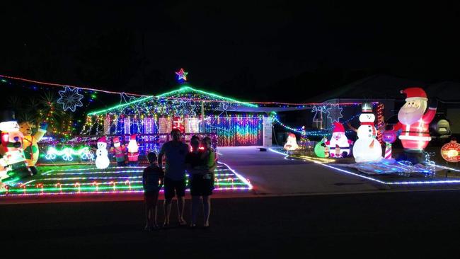 Matt, Tegan and their two children put up lights every year outside their Jimboomba home for the joy it sparks on their children's faces. Picture: Supplied