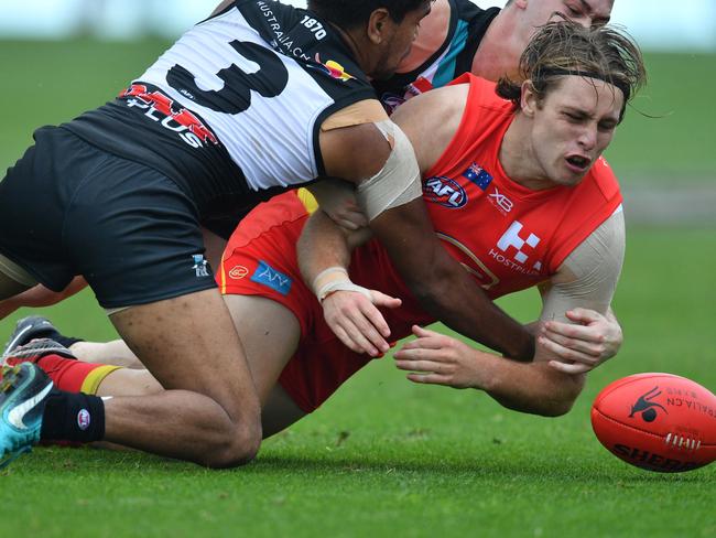 Jake Neade of the Power tackles Brad Scheer of the Suns during the Round 9 AFL match between the Gold Coast Suns and the Port Adelaide Power at the Adelaide Arena at Jiangwan Stadium in Shanghai, China, Saturday, May 19, 2018. Picture: AAP Image/David Mariuz.