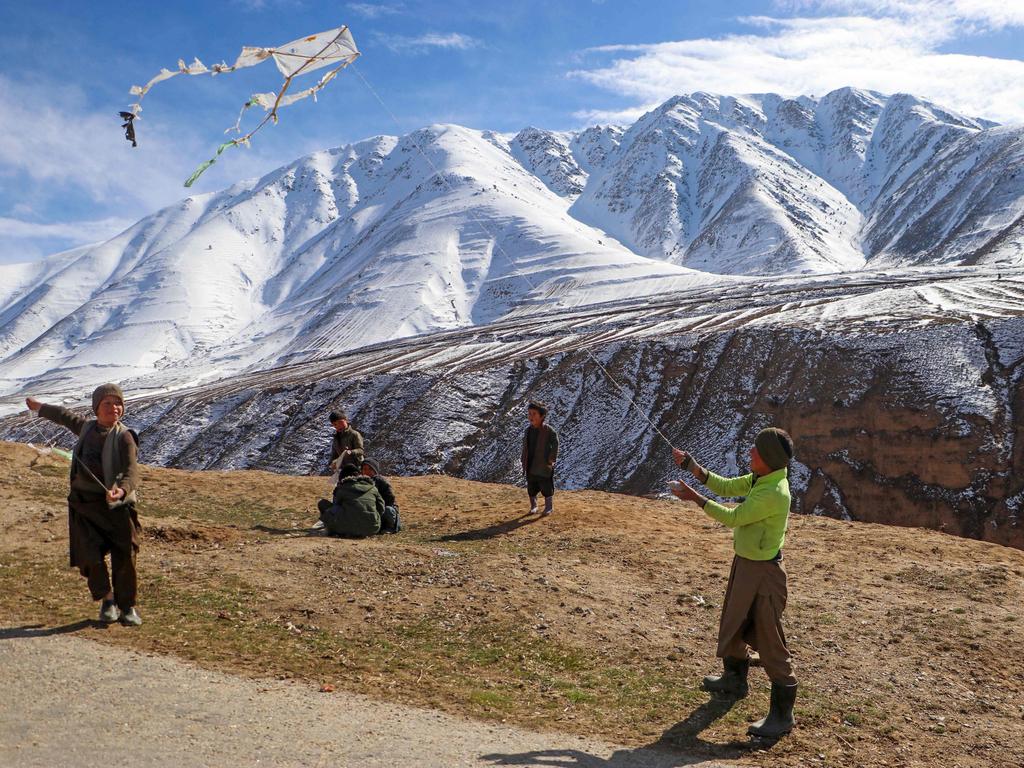 Afghan boys fly kites on a hilltop in Badakhshan. Picture: Omer Abrar/AFP