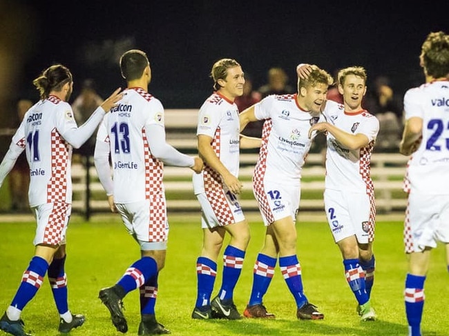 The Knights celebrate a fourth goal in the 4-0 win over Peninsula Power. Picture: East End Digital