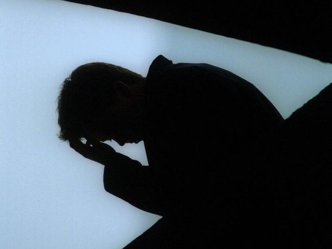 # BEFORE REUSE OF THIS IMAGE CHECK CONTENT AND COPYRIGHT ISSUES WITH THE /PICTURE /DESK- 03 Jul 2001  Young man, youth with his head in his hands suffering depression, suicide threat. mental illness. silhouette sad unhappy stress generic