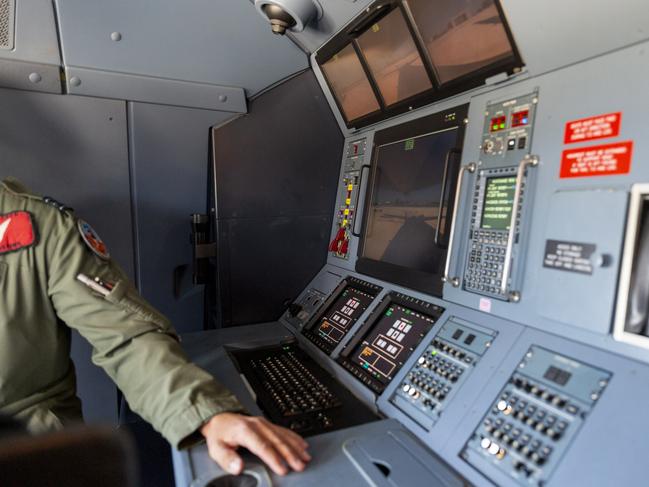 “Essentially what I’ve got here, is a large screen so I can see what the aircraft is doing, as well as the screen at the top and on the left hand side here I have the refuelling equipment to push the hose out,” Brown said. Picture: Floss Adams.