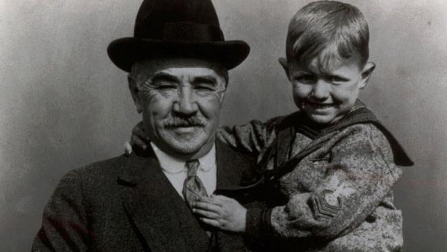 Milton S Hershey with a young child from his orphan school in Hershey, Pennsylvania, in the late 1930s.