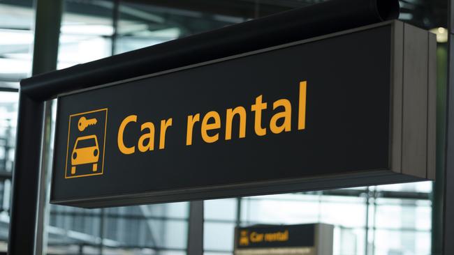 Generic photo of a car rental sign at an airport