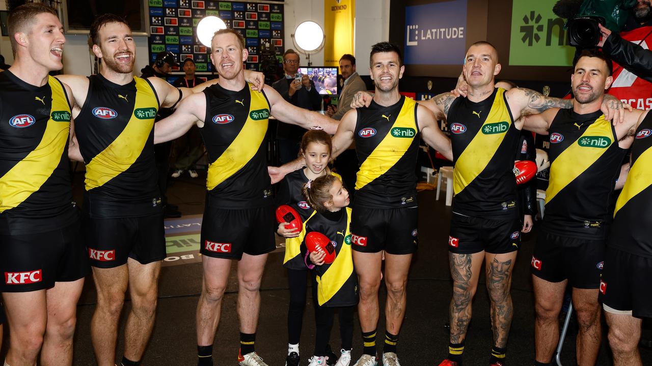 Richmond players sing the team song after their third win in four games. Picture: Michael Willson