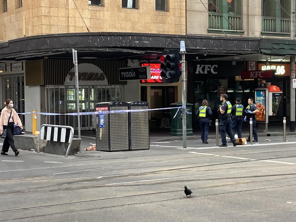 A second crime scene has been established at the corner of Flinders Lane after a woman was attacked. Picture: Brandon Demura