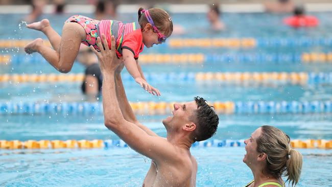 Libby Trickett with husband Luke and daughter Poppy. Pic Peter Wallis