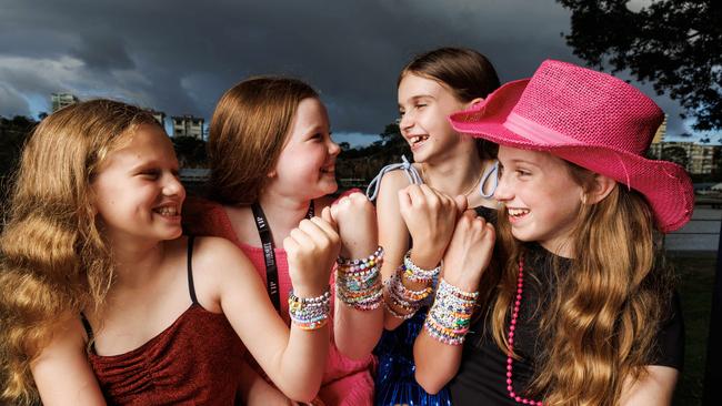 Taylor Swift Fans Marcie Kehoe 10, Willow Ellem 11, Erin Johns 11, and Rebecca Kehoe 12, with their friendship bracelets. Picture: Lachie Millard