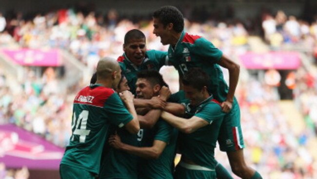 Mexico celebrate their Olympic gold medal final win over Brazil.