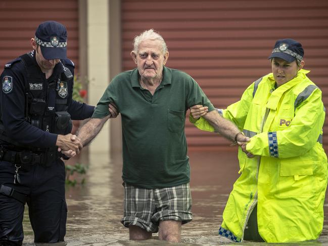 Eighty-two-year-old Terry Rowland is rescued from his flooded home in Hermit Park, Townsville. Picture: Glenn Hunt