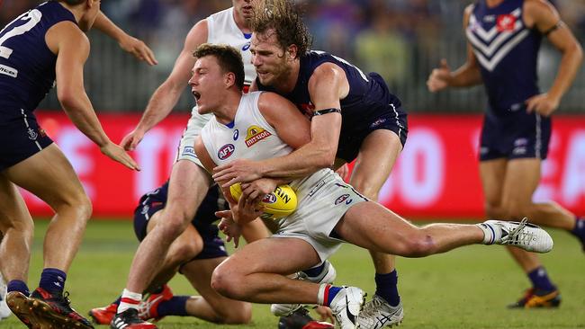 Jack Macrae is tackled by Docker David Mundy. Picture: Getty Images