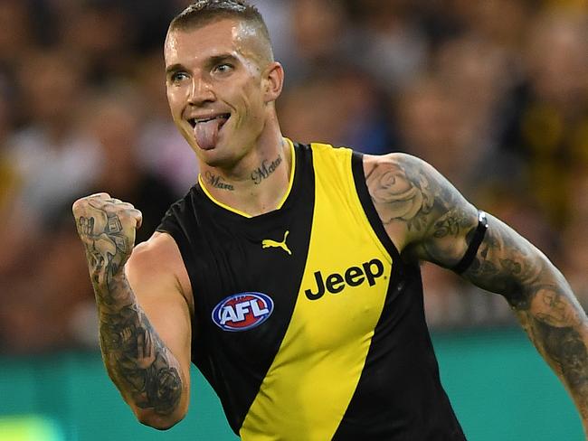 Dustin Martin of the Tigers reacts after kicking a goal during the Round 1 AFL match between the Carlton Blues and the Richmond Tigers at the MCG in Melbourne, Thursday, March 23, 2017. (AAP Image/Julian Smith) NO ARCHIVING, EDITORIAL USE ONLY