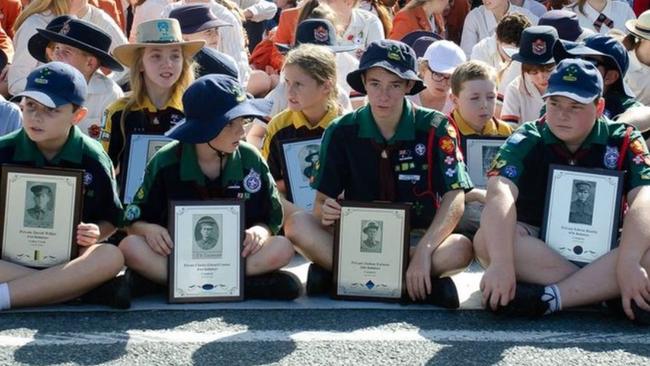 Young children attending the Upper Coomera war memorial. The Cenotaph will be moved after the 2024 Anzac Day ceremony.