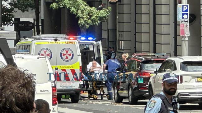 A male victim is loaded into an ambulance as officers attended and found a man believed to be suffering a gunshot wound in Sydney's CBD. A man has been arrested and there is no further ongoing threat to the community. Picture: The Australian