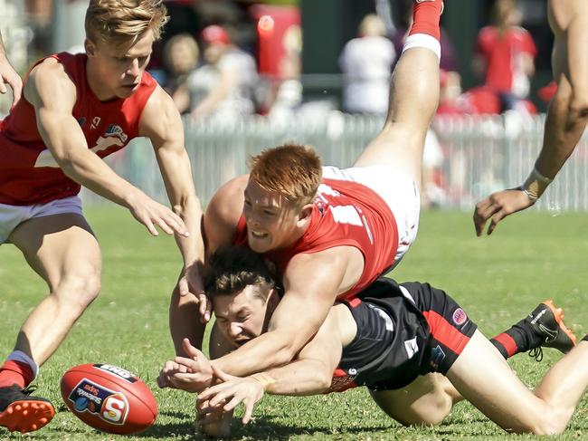 SANFL - North v West at Prospect Oval Saturday April 6, 2019 Norths Mitchell Harvey into the back of Wests Murray Waite - pic AAP/MIKE BURTON