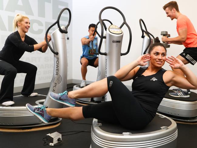 15/03/17 Nicole Christey, Jeff Zheng, Rachel Simpson and Dan Vanhooijdonk on the Power Plate machines at Virgin Active Gym in Sydney. Picture Renee Nowytarger. The Australian