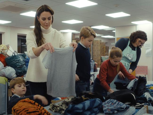 The Princess of Wales launching the Christmas Baby Banks initiative late last year. Internet sleuth Diane Lyssa claims Catherine and Charlotte are wearing the same tops in the doctored image – but the colour of Catherine’s jumper has been changed. Picture: Kensington Palace/YouTube