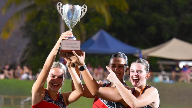Commerce Pints' Joline Bouwer, Zita Varatharajan and Macenzee Dixon proudly lift the TPL Women's Premiership Trophy. Picture: Darcy Jennings.