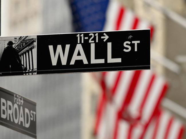 Street sign near the New York Stock Exchange at Wall Street on February 24, 2022 in New York. - Wall Street stocks opened sharply lower Thursday, joining a global equity sell-off after Russia's invasion of Ukraine lifted energy prices and prompted debate on further sanctions. (Photo by ANGELA WEISS / AFP)