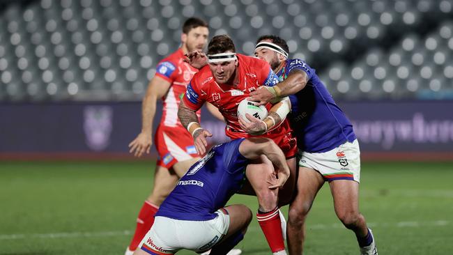 GOSFORD, AUSTRALIA – JULY 02: Josh McGuire of the Dragons is tackled during the round 16 NRL match between New Zealand Warriors and the St George Illawarra Dragons at Central Coast Stadium, on July 02, 2021, in Gosford, Australia. (Photo by Ashley Feder/Getty Images)