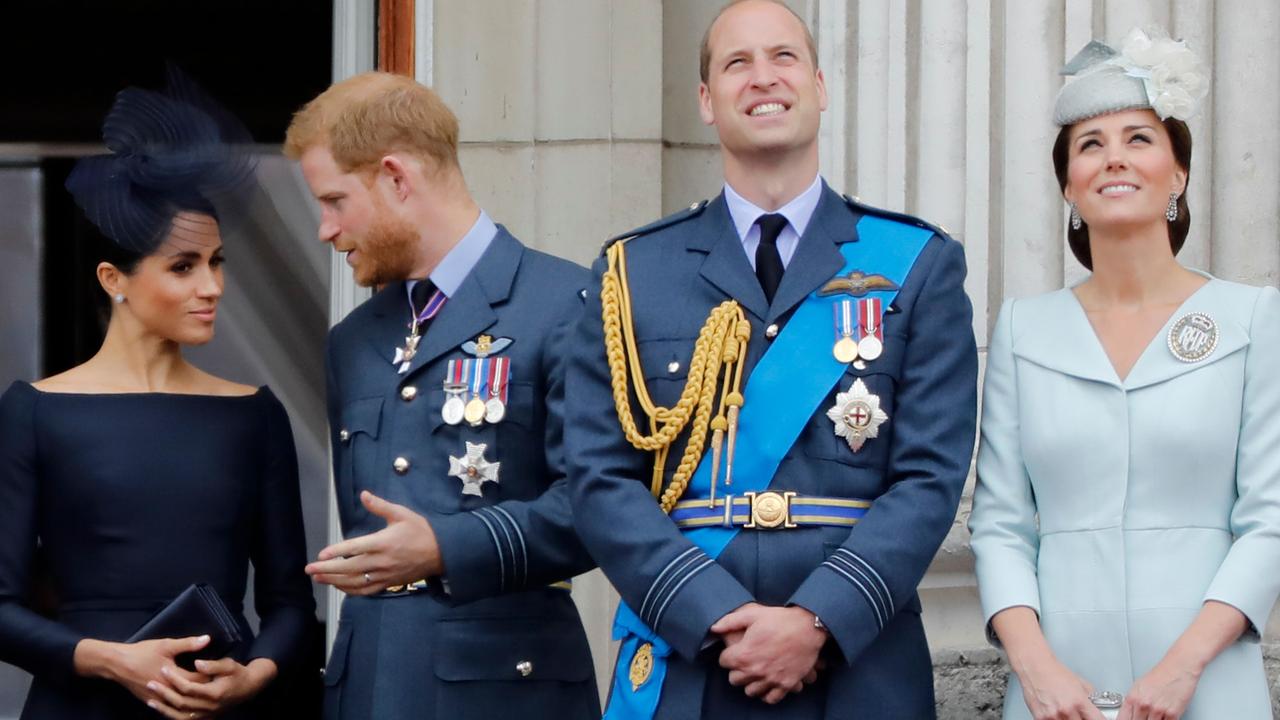 Meghan, Prince Harry, Prince William and Kate stand on the balcony of Buckingham Palace to watch a military fly-past to mark the centenary of the Royal Air Force (RAF) in 2018. Picture: Tolga Akmen/AFP